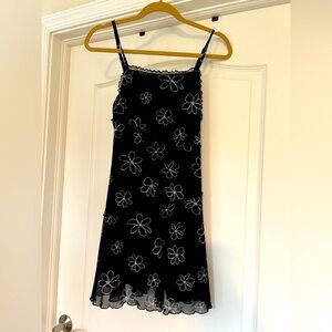 Black mini dress with daisies.